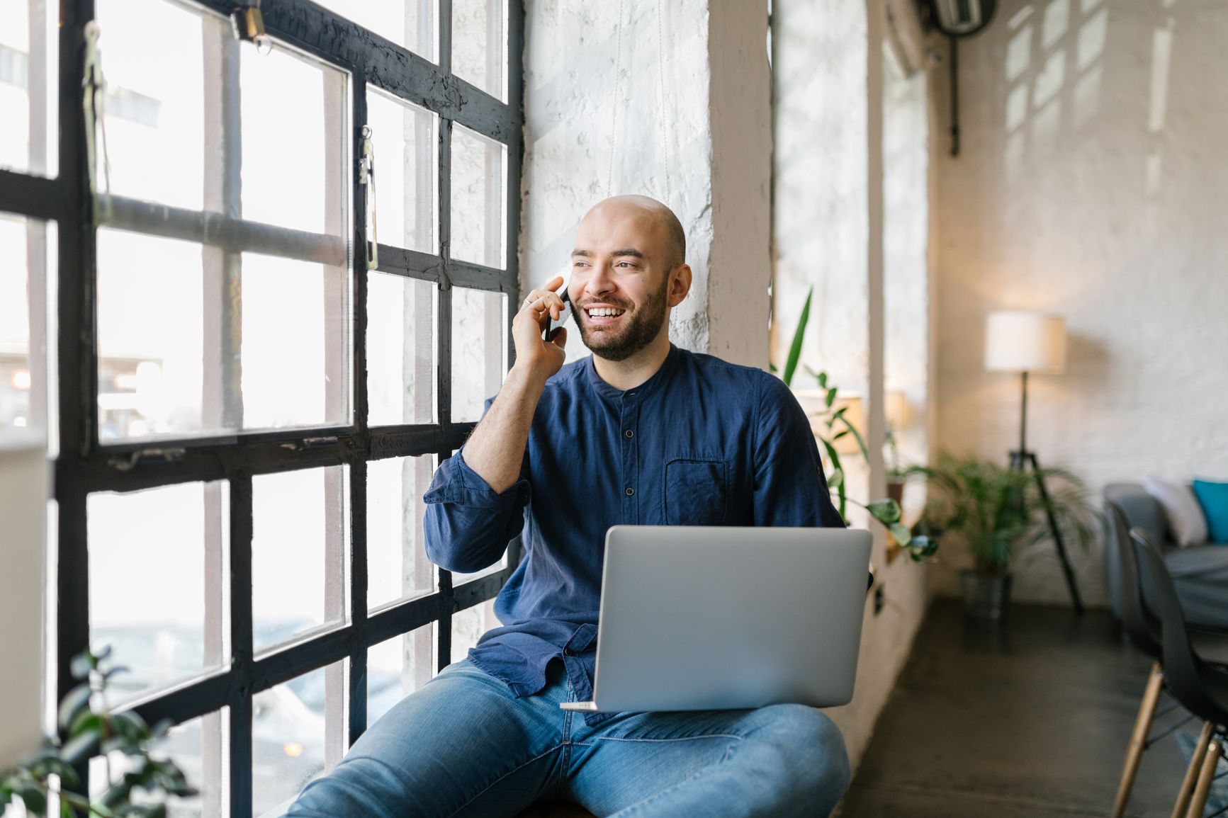 Man on the phone with laptop