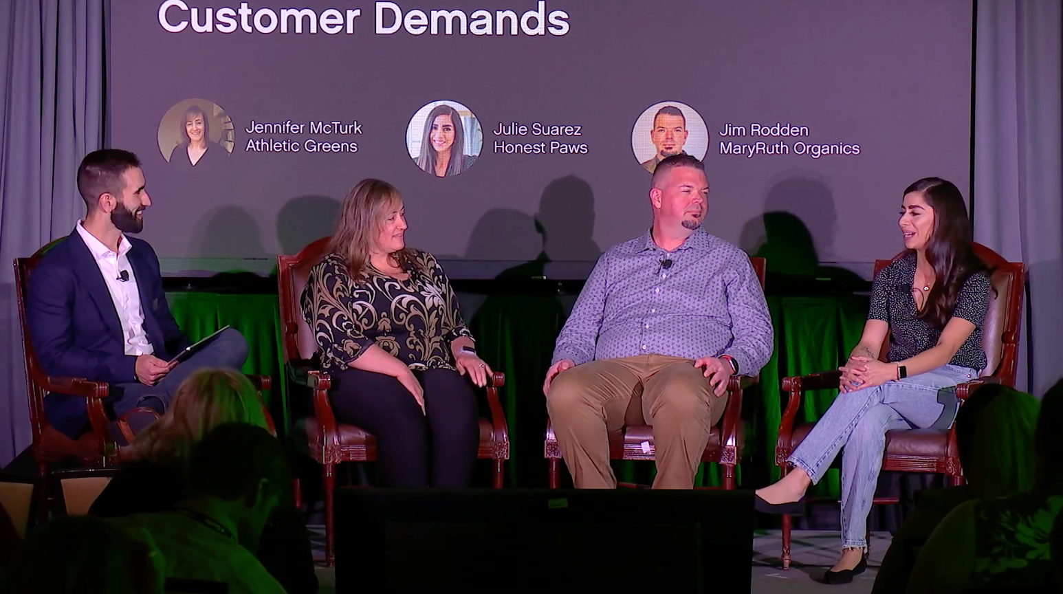 Four people sitting on a panel at Gladly Connect Live