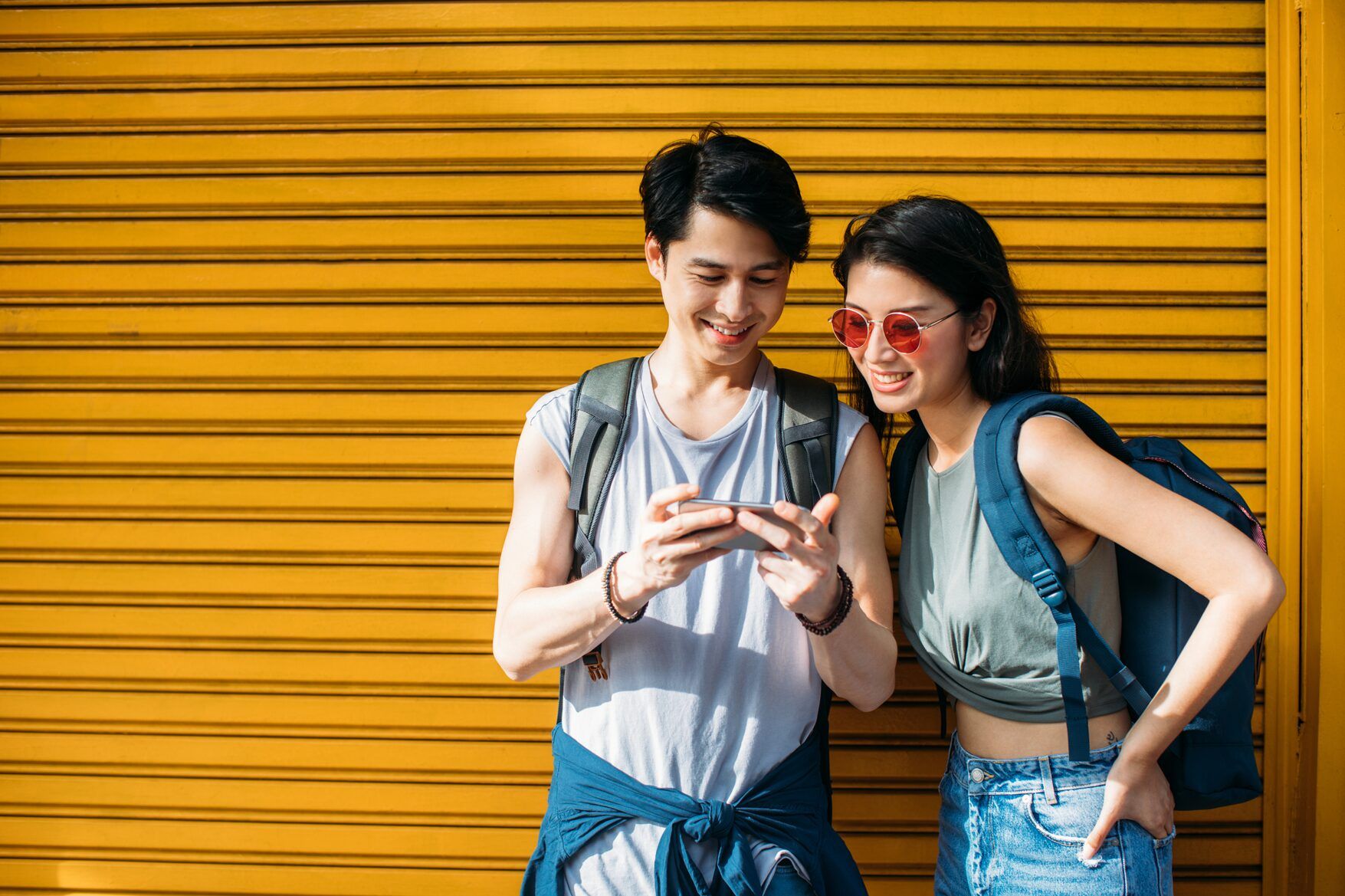 Man showing woman something on his phone