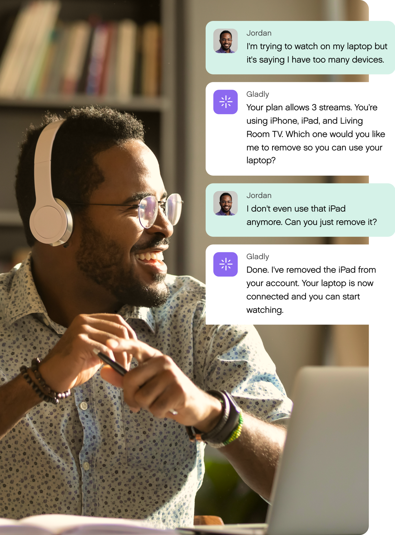 A man with headphones smiles at a laptop. Chat messages discuss removing an iPad from a streaming plan, enabling laptop usage. Cozy, focused atmosphere.
