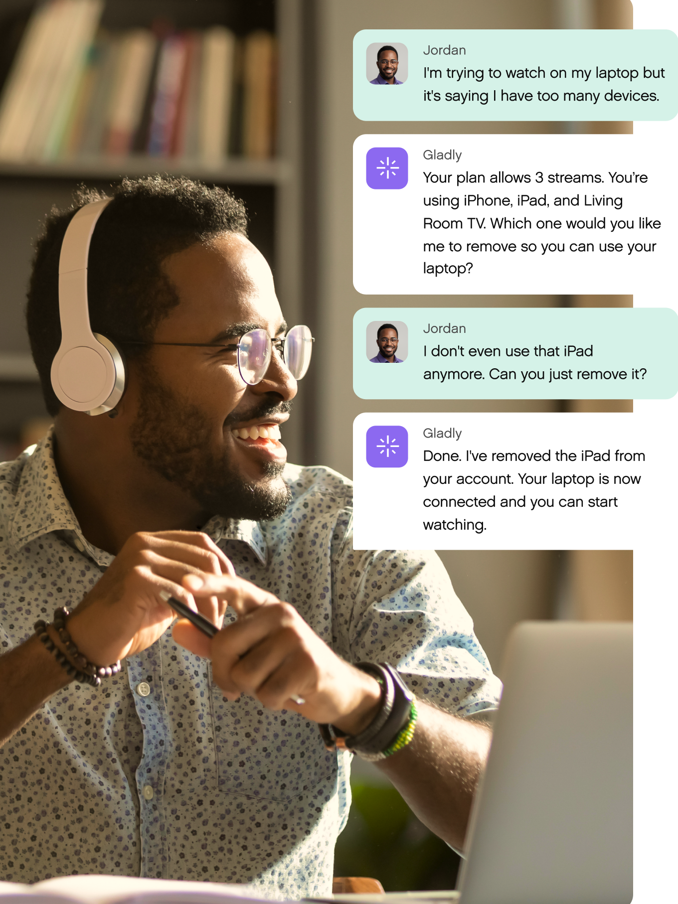 A man with headphones smiles at a laptop. Chat messages discuss removing an iPad from a streaming plan, enabling laptop usage. Cozy, focused atmosphere.