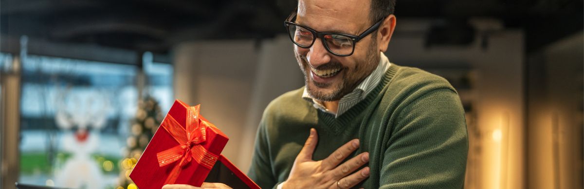 man looking at a present