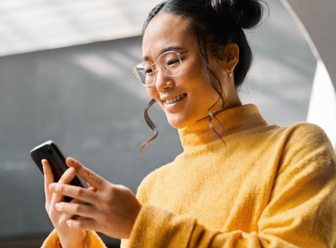Woman smiling on cell phone