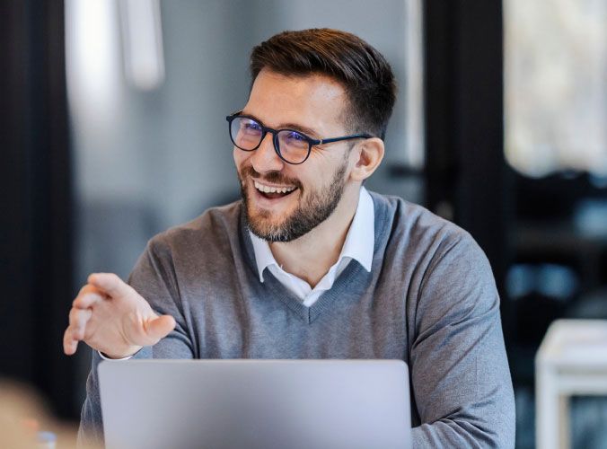 Smiling man on laptop