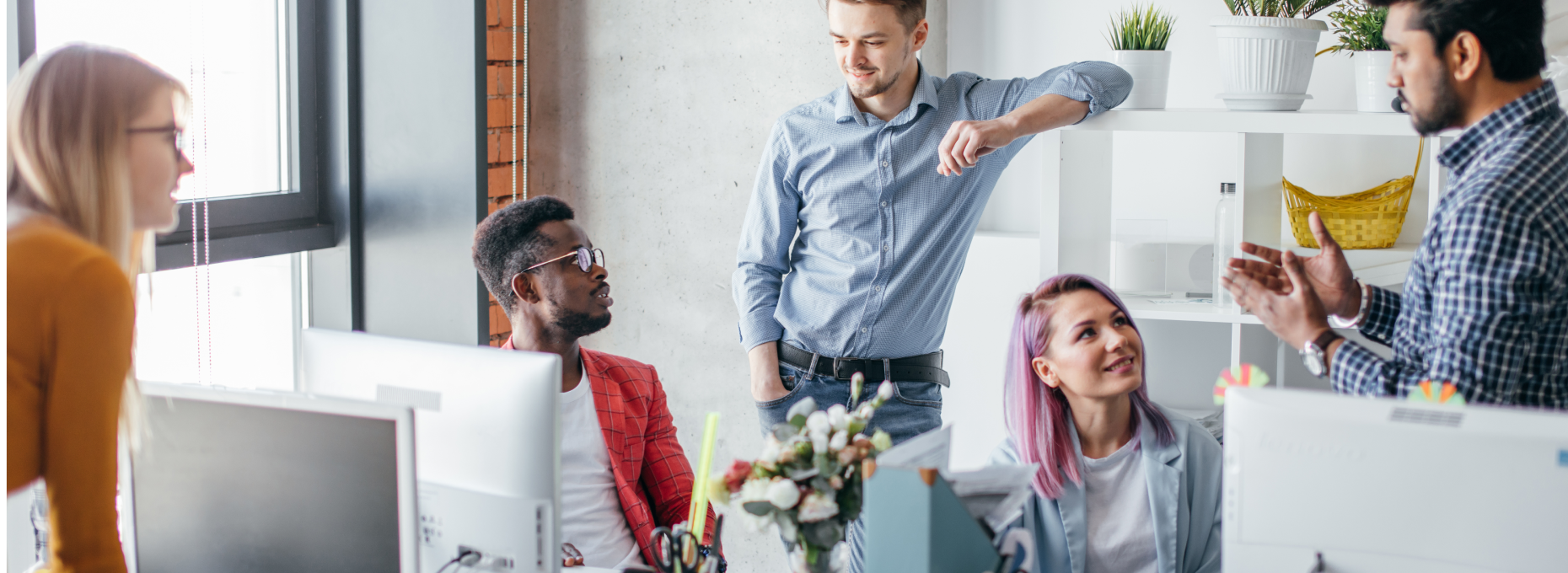Small team of professionals discussing business in an office