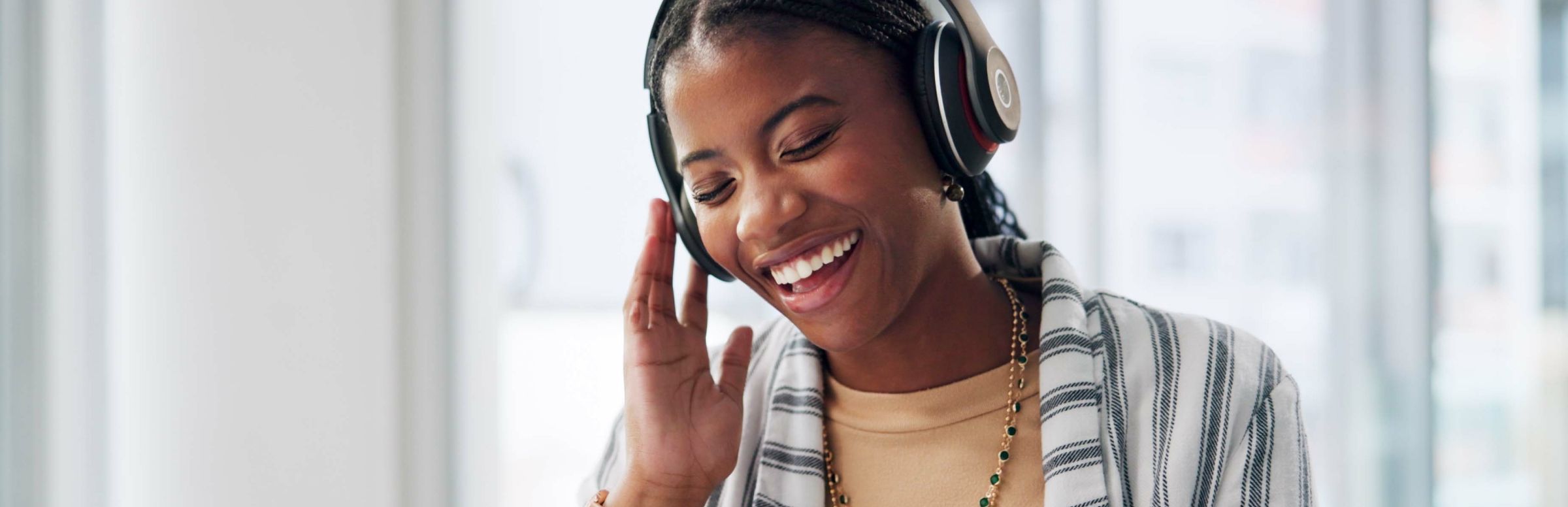Woman smiling with headphones on