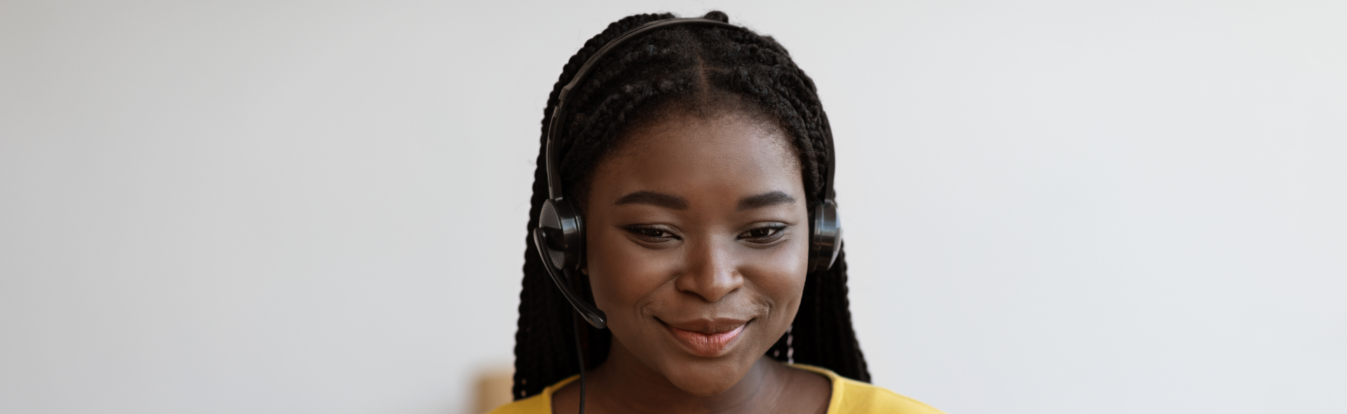 Smiling customer service rep wearing a phone headset