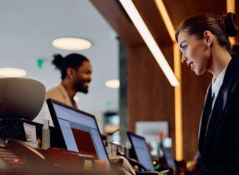 woman working at a hotel desk