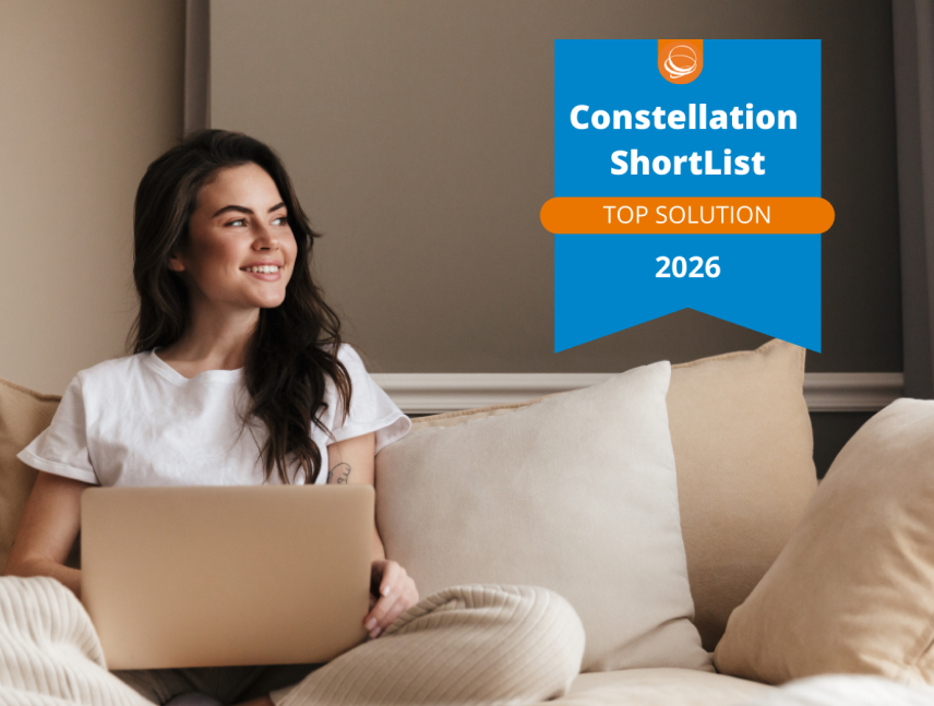 Woman smiling at laptop with Constellation ShortList 2026 Top Solution badge