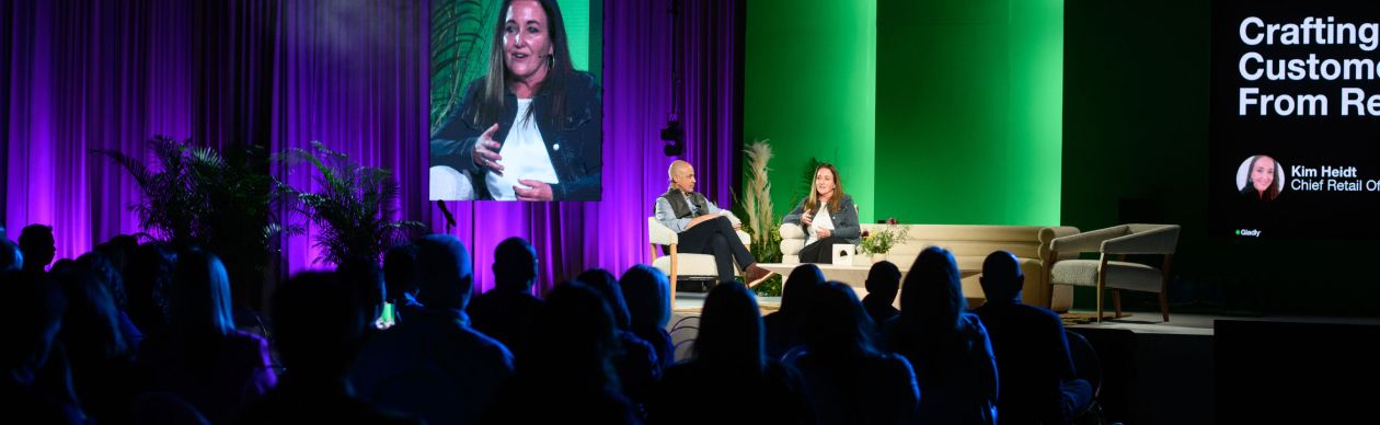 Audience watching two people onstage