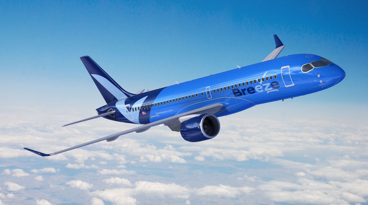 Breeze airways plane flying through the sky