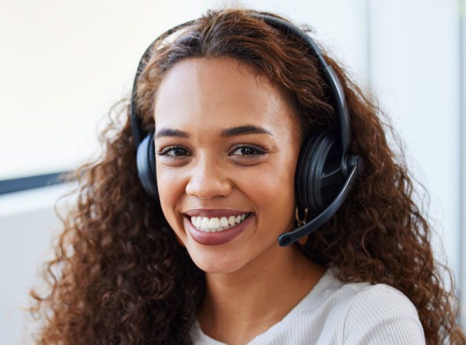 Smiling customer service agent looking at camera