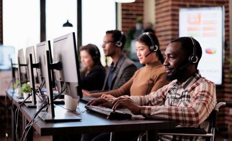 A row of customer service representatives at work