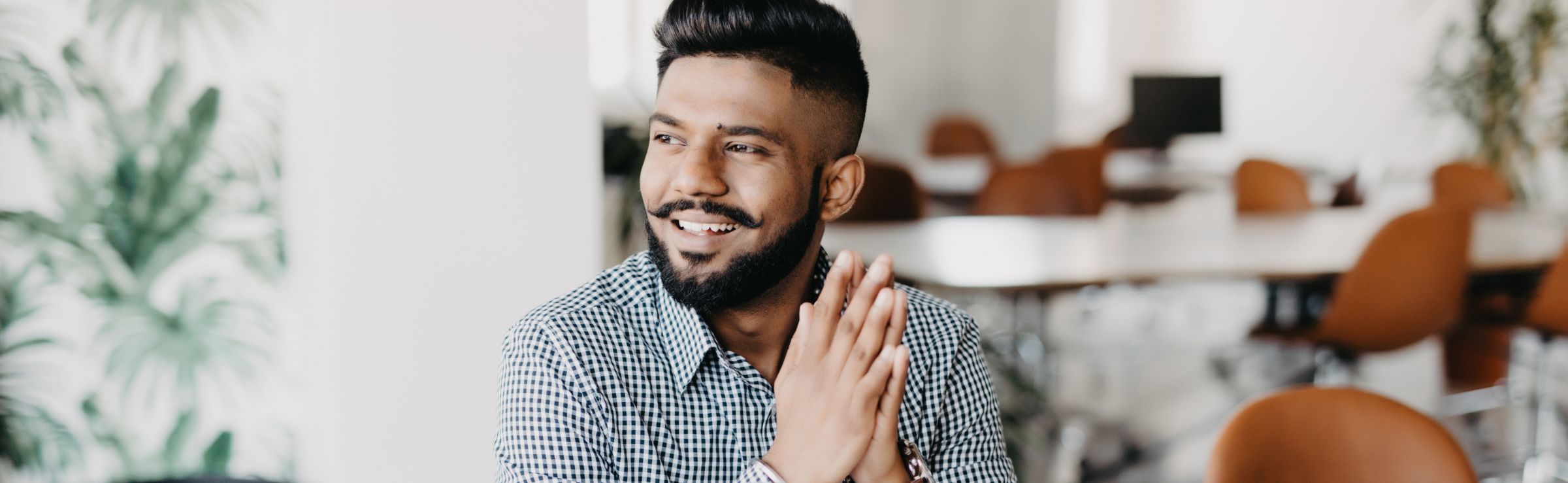 Man sitting in an office. Natural language processing header.