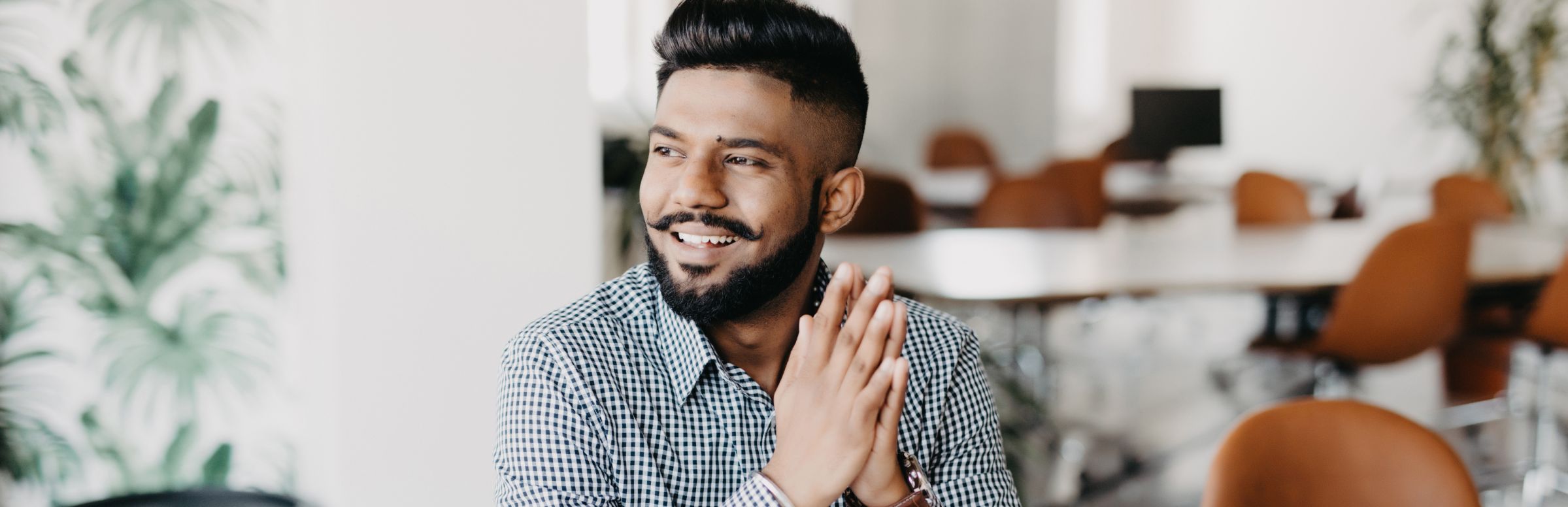 Man sitting in an office. Natural language processing header.