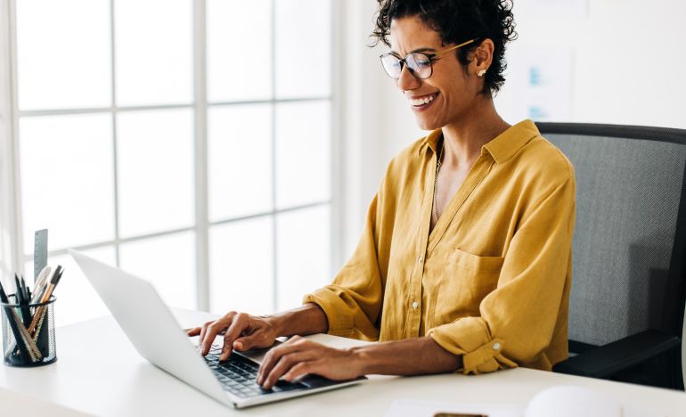 A customer on their computer feeling safe because the company they're using has SOC 2 Type II compliance