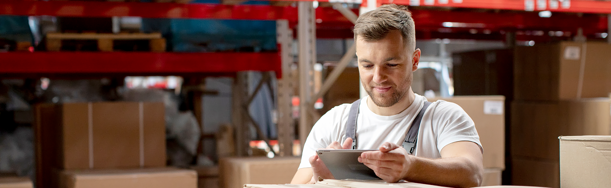 Man using tablet in warehouse