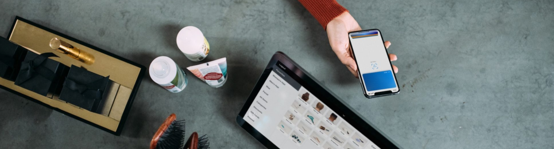 Someone holding out their smartphone to pay for a purchase