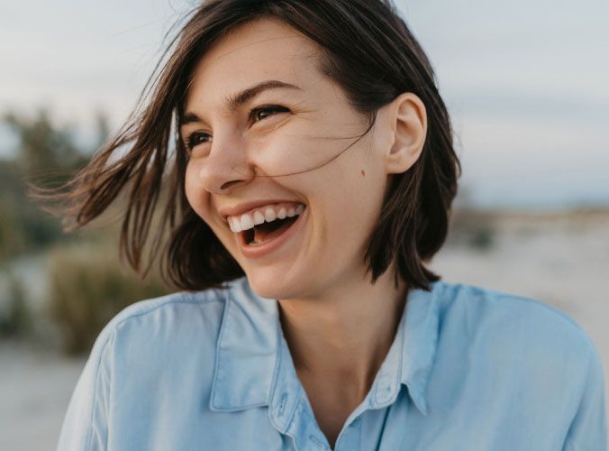 Woman with brown hair smiling