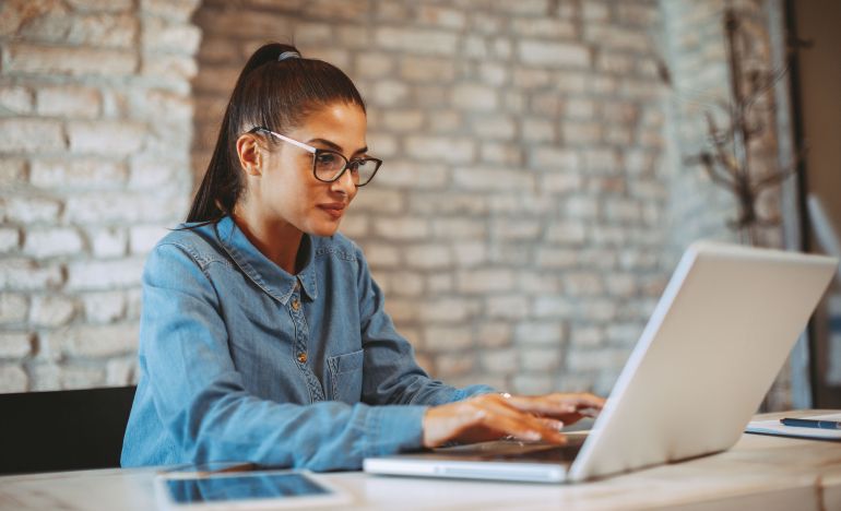 lady building a customer-focused business strategy on her laptop