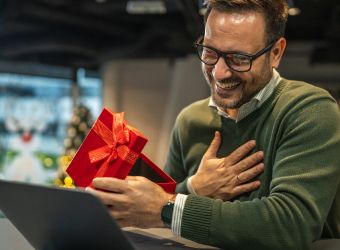 man looking at a present