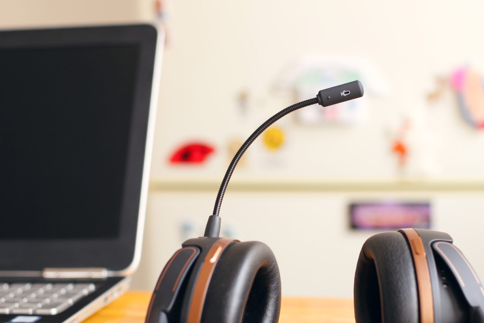 Headphones next to a laptop