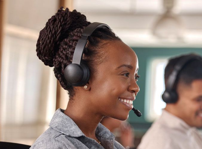Customer service agent smiling with headset