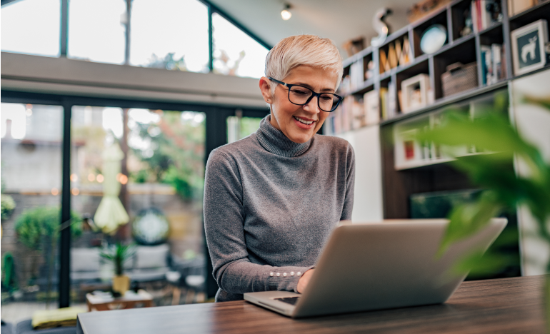 Elderly woman using laptop