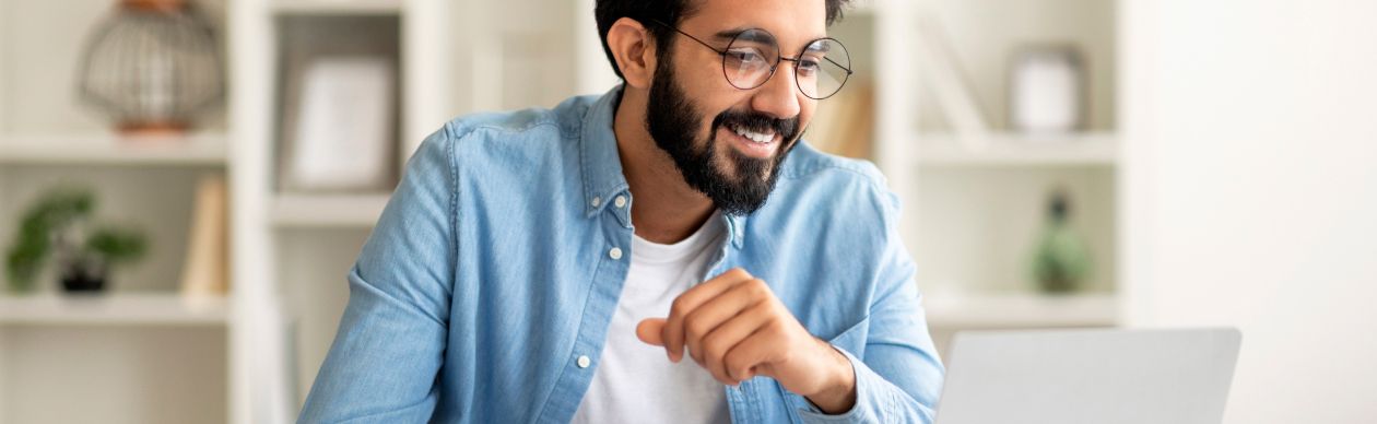 A person reading about AI misconceptions on their laptop