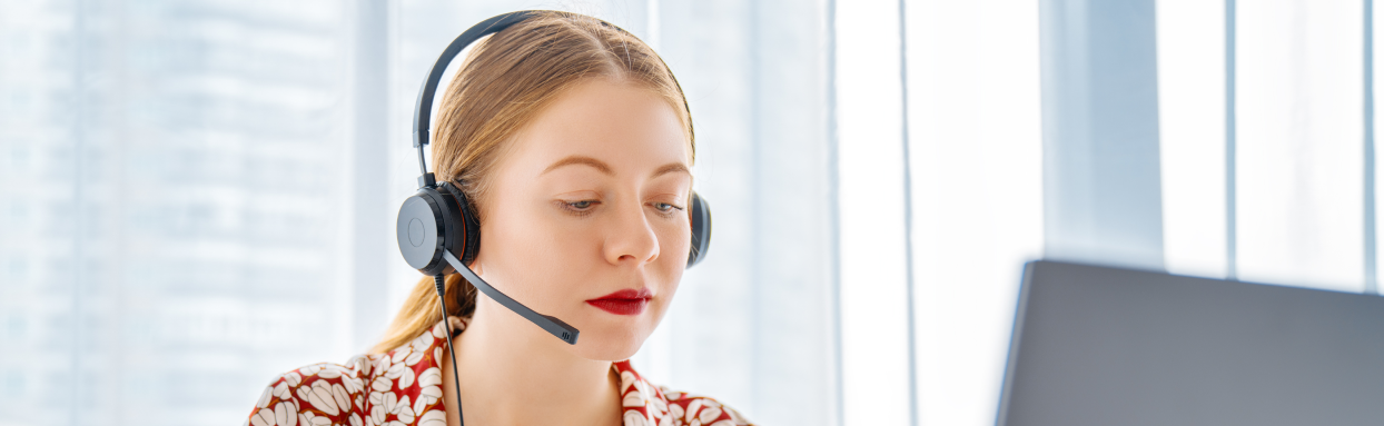 Female Customer Service Agent in front of a laptop