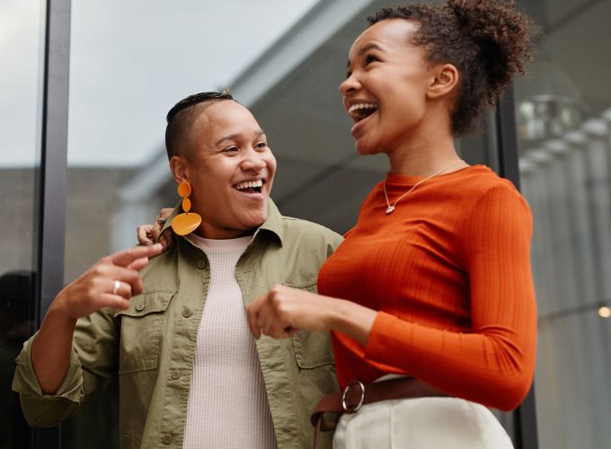 Two people embracing and smiling