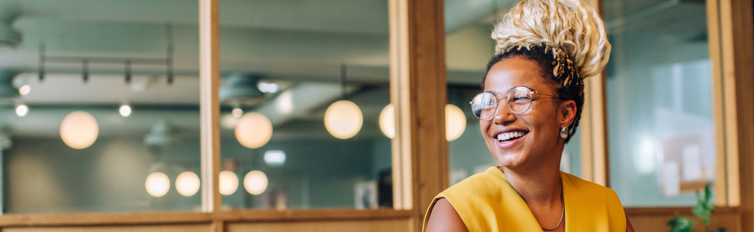Woman smiling while using laptop
