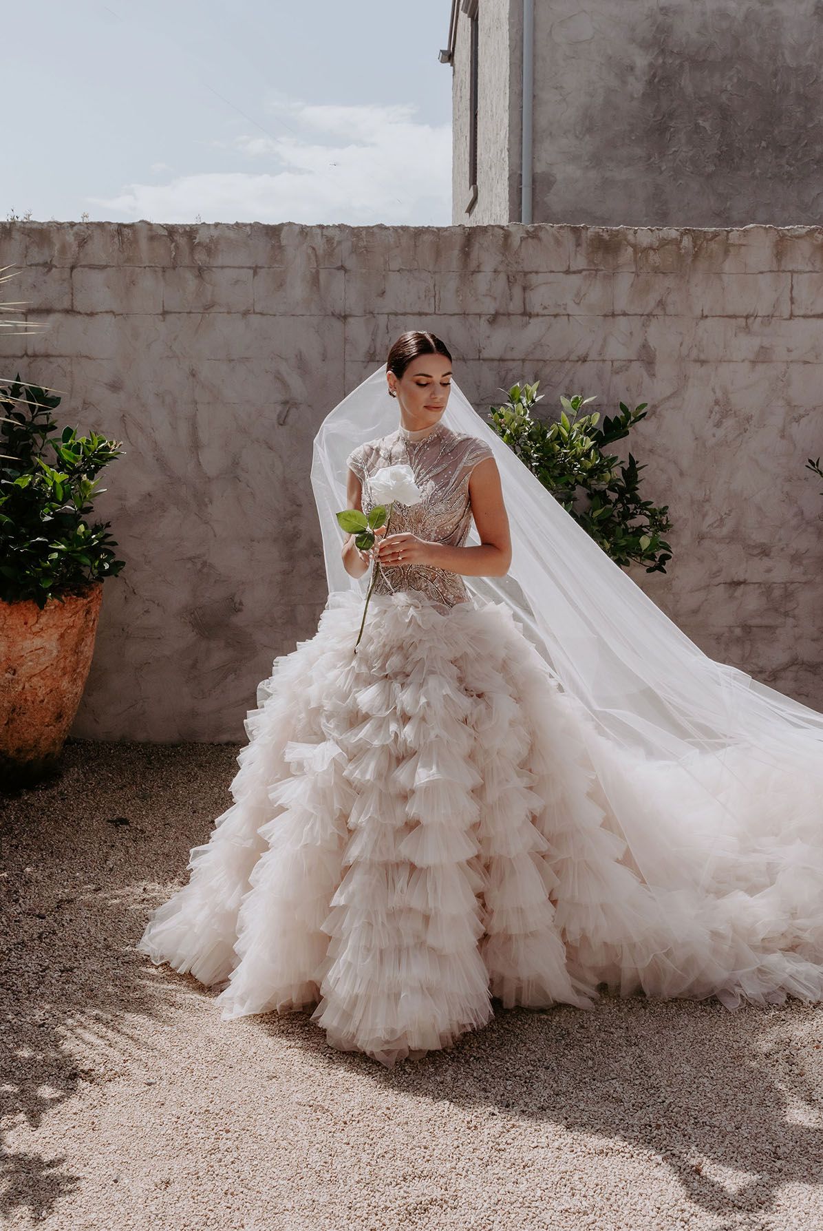 KYHA bride in tulle ruffled gown with full skirt and high neck beaded bodice 
