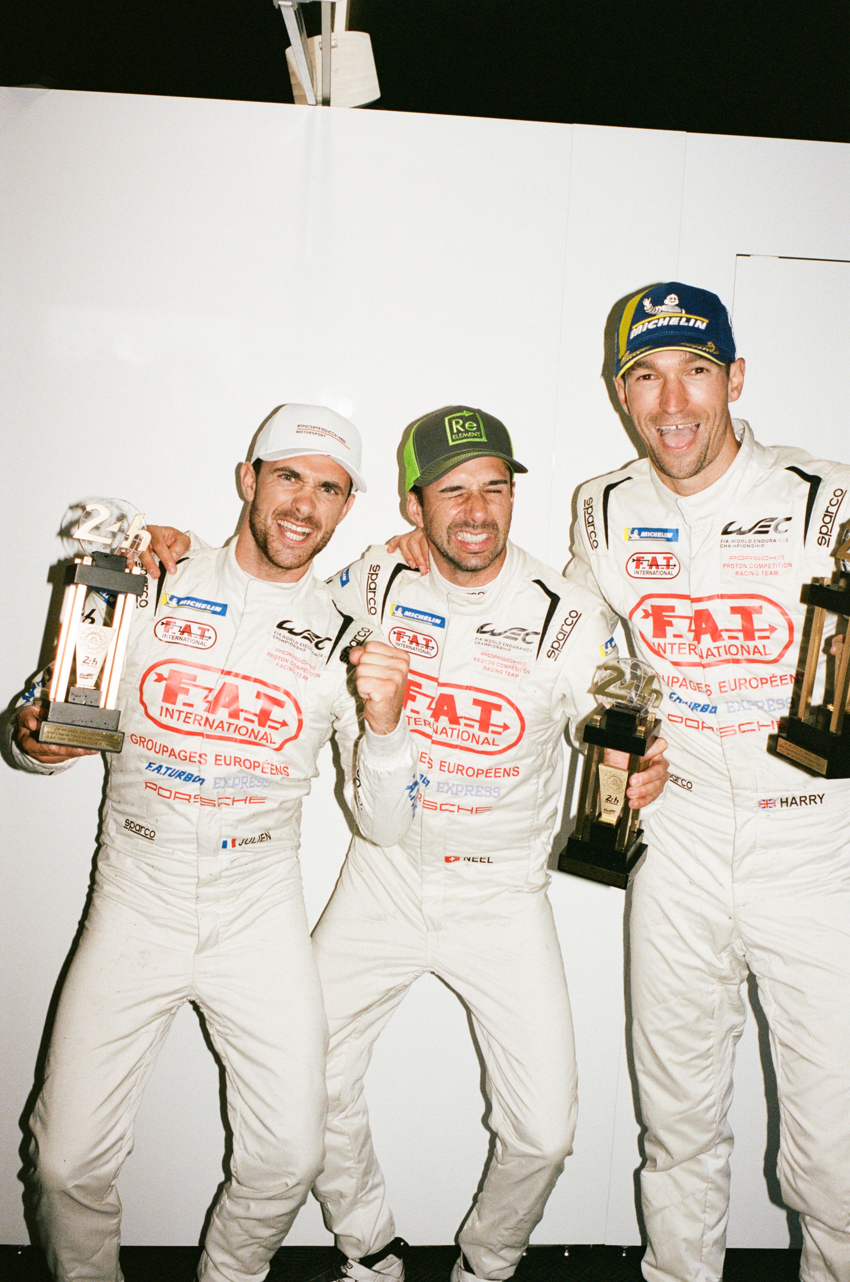 Proton Competition Racing Team drivers Neel Jani, Harry Ticknell, and Julien Andlauer holding their trophies for 3rd place in the Privateer class