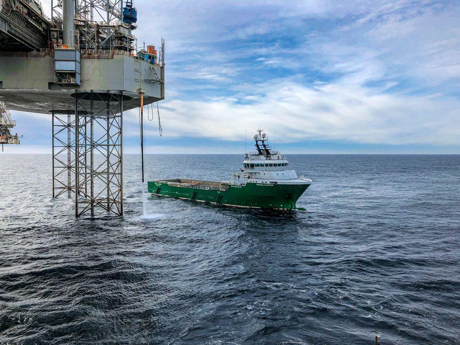 Supply vessel alongside an offshore platform