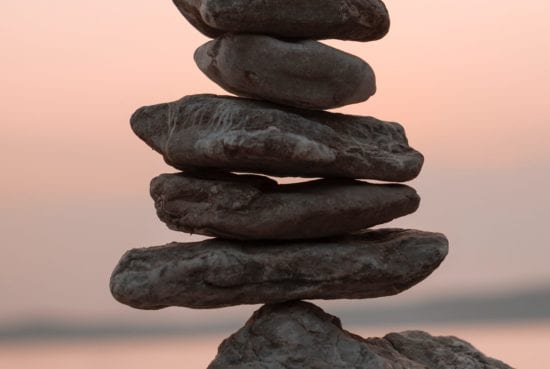 a pile of rocks stacked on top of each other on a rock .