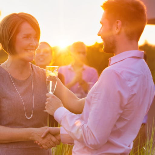 Man holding a wine of glass with his partner