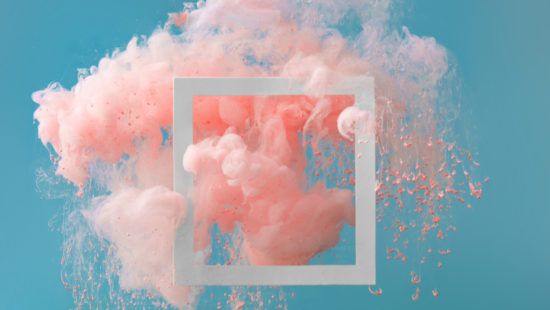 pink and white smoke is coming out of a square on a blue background .