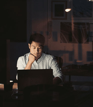 The importance of timing in business image of man looking at laptop