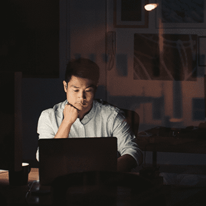 The importance of timing in business image of man looking at laptop