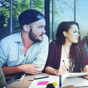 The personality dynamics of winning teams image of man & woman at a table in a meeting