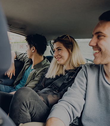 The power of culture and vision image of people in the backseat of a car