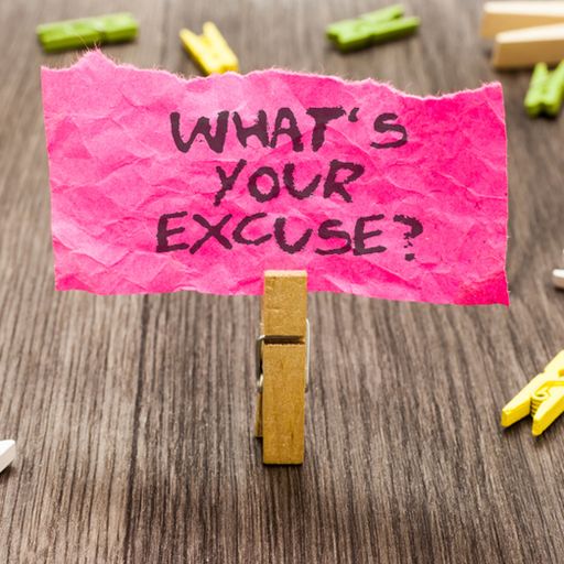 a pink piece of paper with the words `` what 's your excuse '' written on it is sitting on a wooden table .
