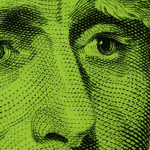 a close up of a dollar bill with a green background