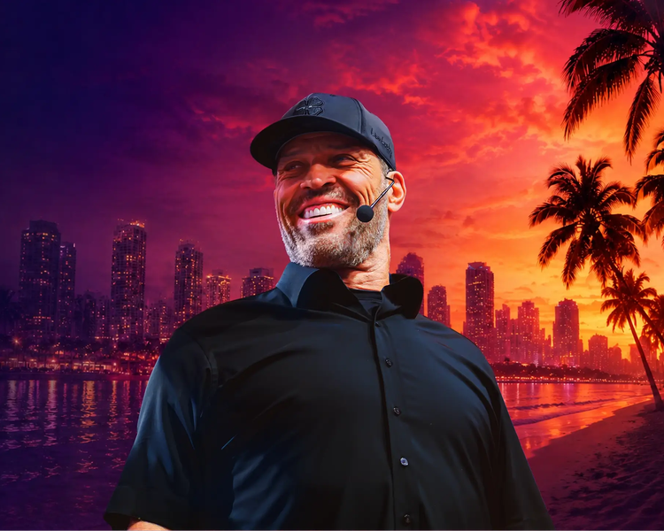 Tony Robbins smiles against a vibrant sunset over a city skyline and a palm-lined beach.