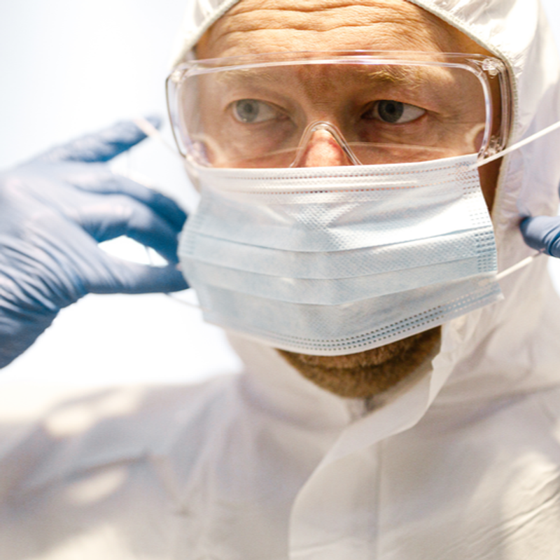 COVID-19 Facts from the Frontline image of a man wearing a mask and gloves