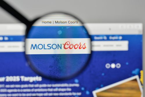 a magnifying glass is looking at the molson coors logo on the website .