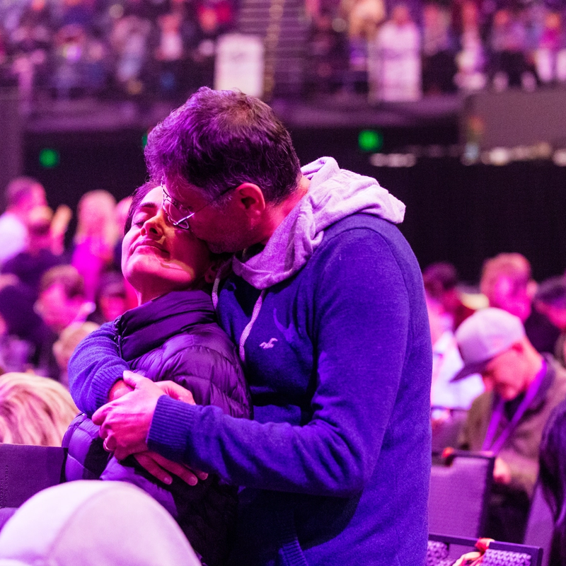 How to be truly present image of man holding woman lovingly