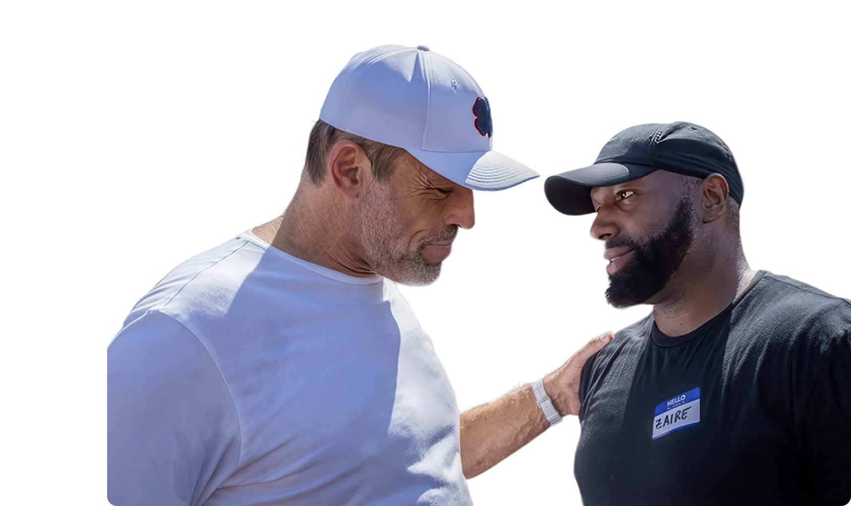 A white man in a white cap and shirt has his arm around a smiling Black man in a black cap and shirt, who wears a 'FAIRE' nametag.