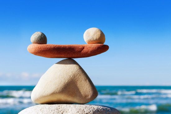 a pile of rocks stacked on top of each other on a beach .